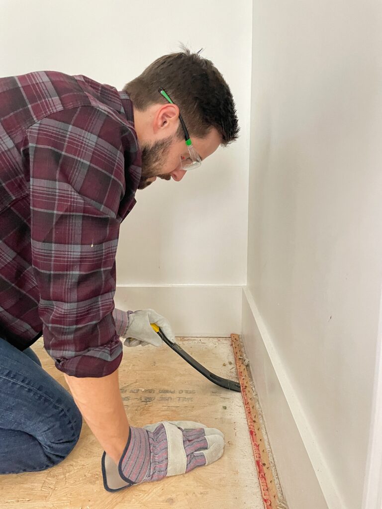 Pulling Tack Strips up with a pry bar for a Stair Remodel