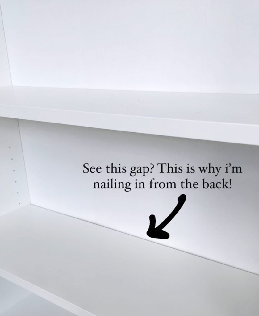 A close up view of Ikea billy bookcases with an arrow and text that says "see this gap? This is why I'm nailing it in from the back"