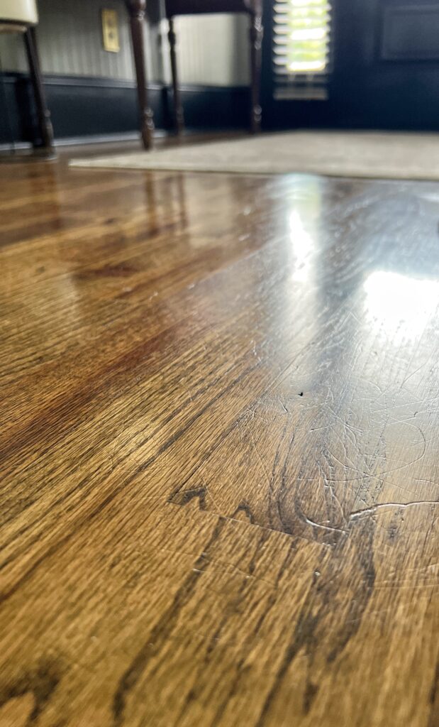 a close up view of glossy engineered hardwood floors