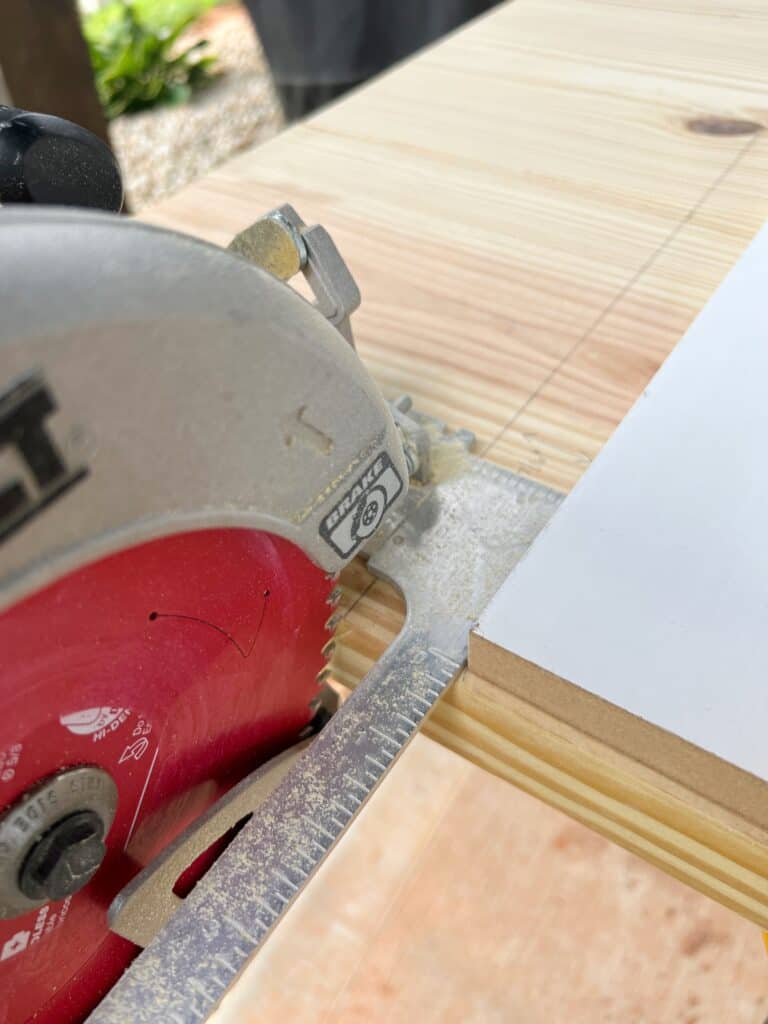 A circular saw with a wood guide to cut a coffee tabletop to size