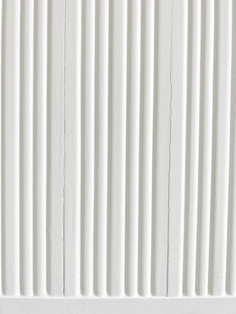 subtle cracks in the seams of an accent wall due to temperature change