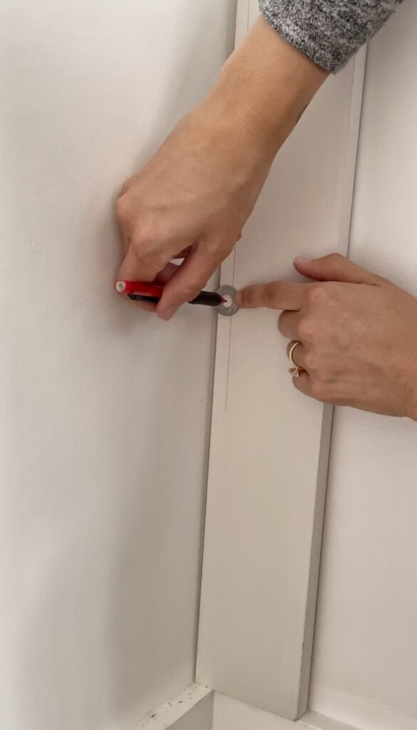 Using a pencil inside a washer and dragging it up the uneven wall to scribe for a cut