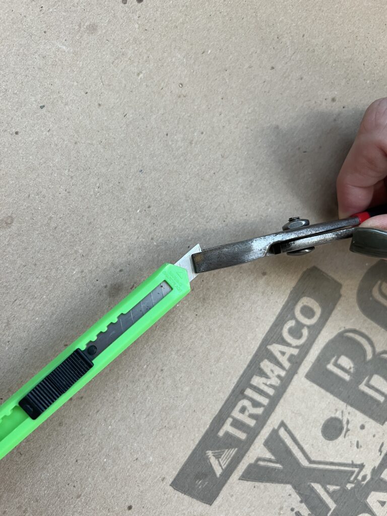 how to safely break off a blade of a utility knife with pliers