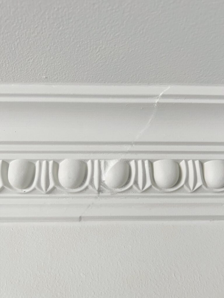 a close up view of a crown moulding seam
