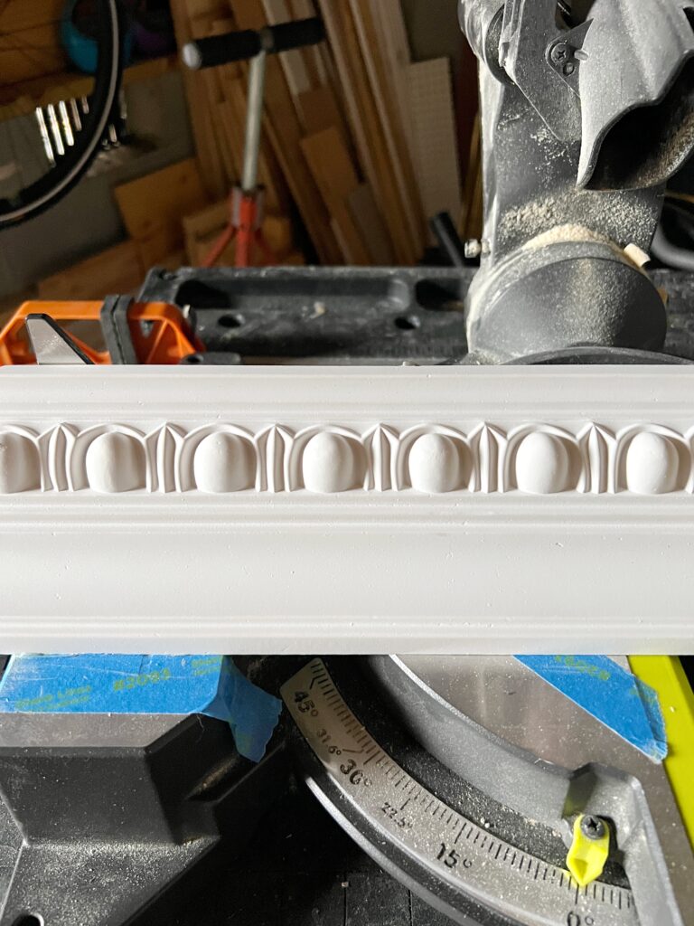 a close up look at egg and dart foam crown moulding