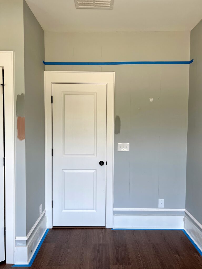 Using painter's tape to find placement for a picture rail hanging system