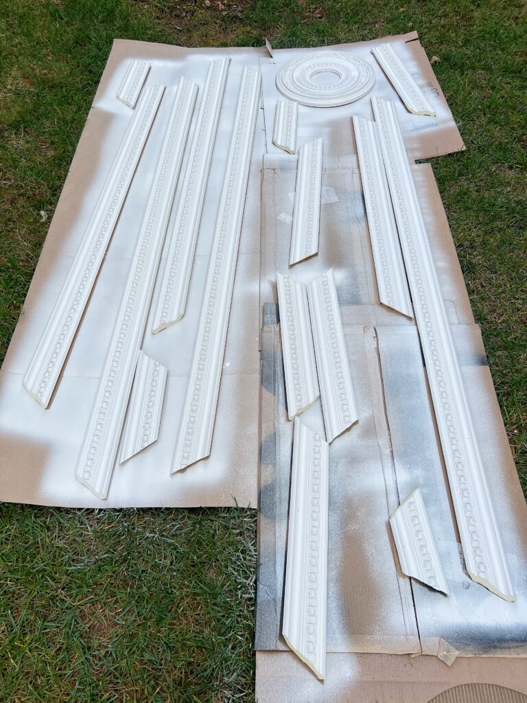 pre-cut crown moulding that was painted using a paint sprayer