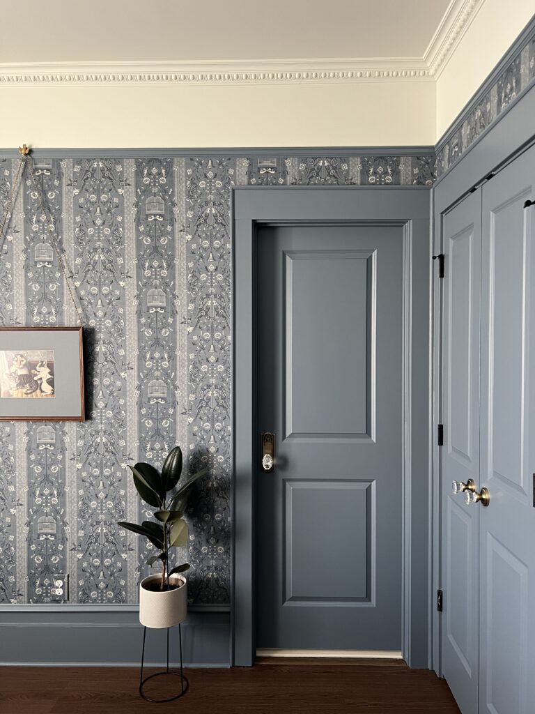 Benjamin Moore bachelor blue painted doors and trim with blue floral wallpaper
