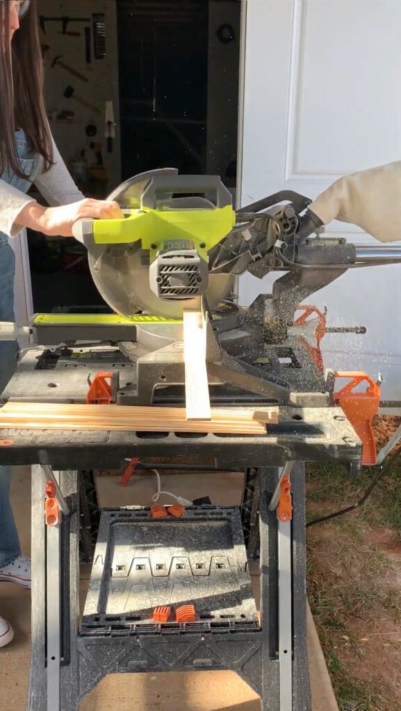 using a miter saw to cut trim for a skinny grid batten wall