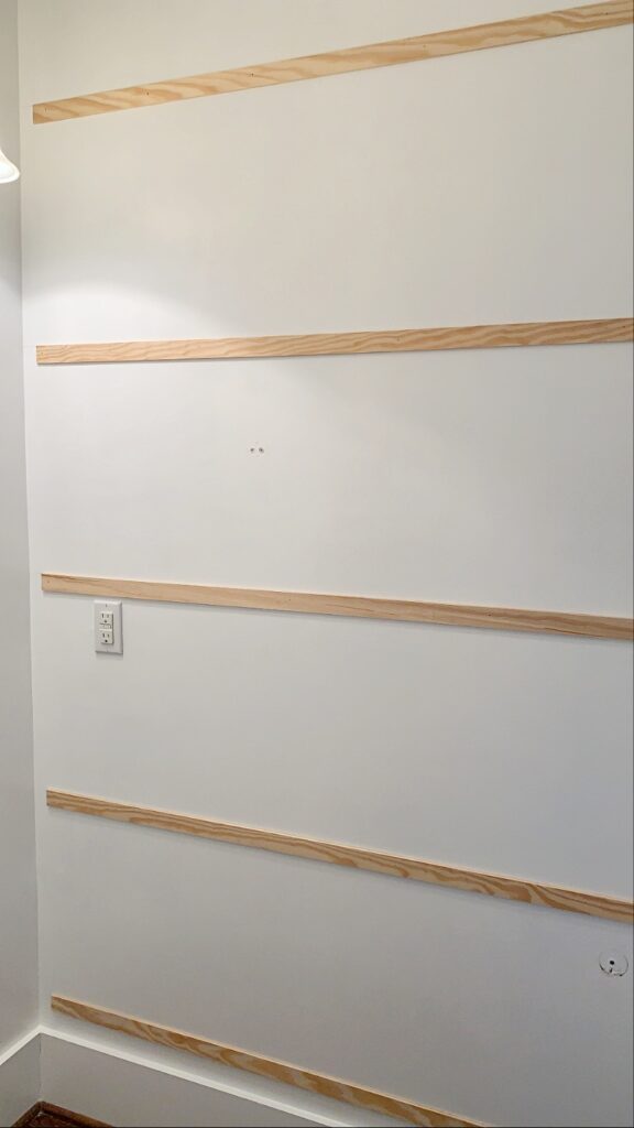 horizontal moulding installed first for a grid accent wall