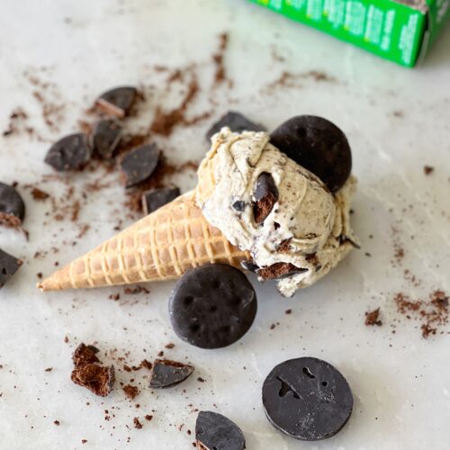 homemade thin mint cookie ice cream in a waffle cone