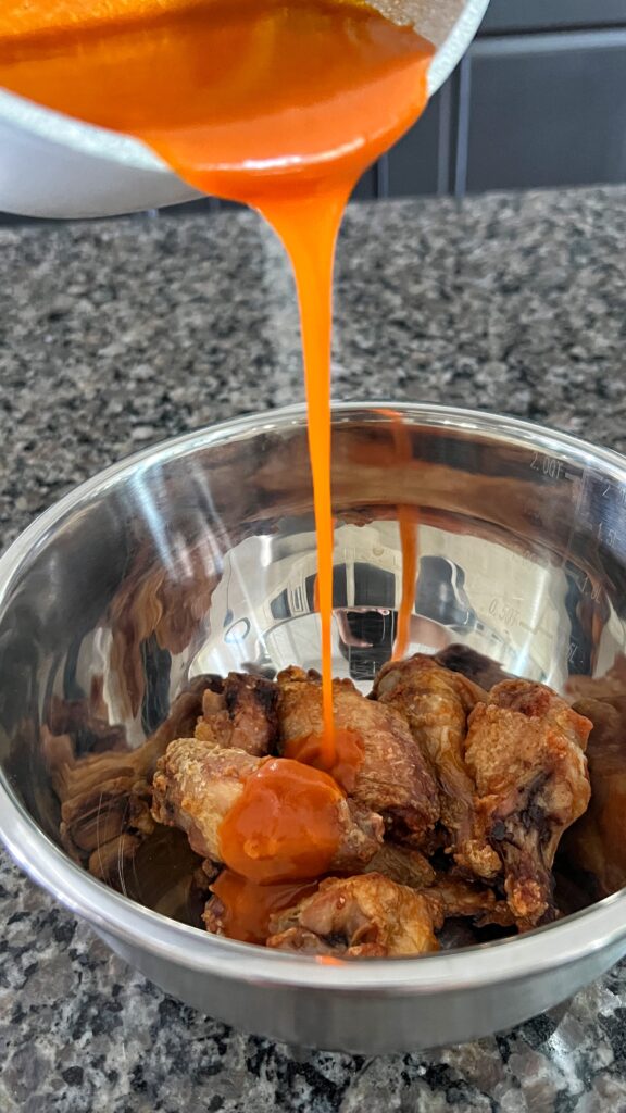 Crispy air fryer chicken wings with a homemade buffalo sauce