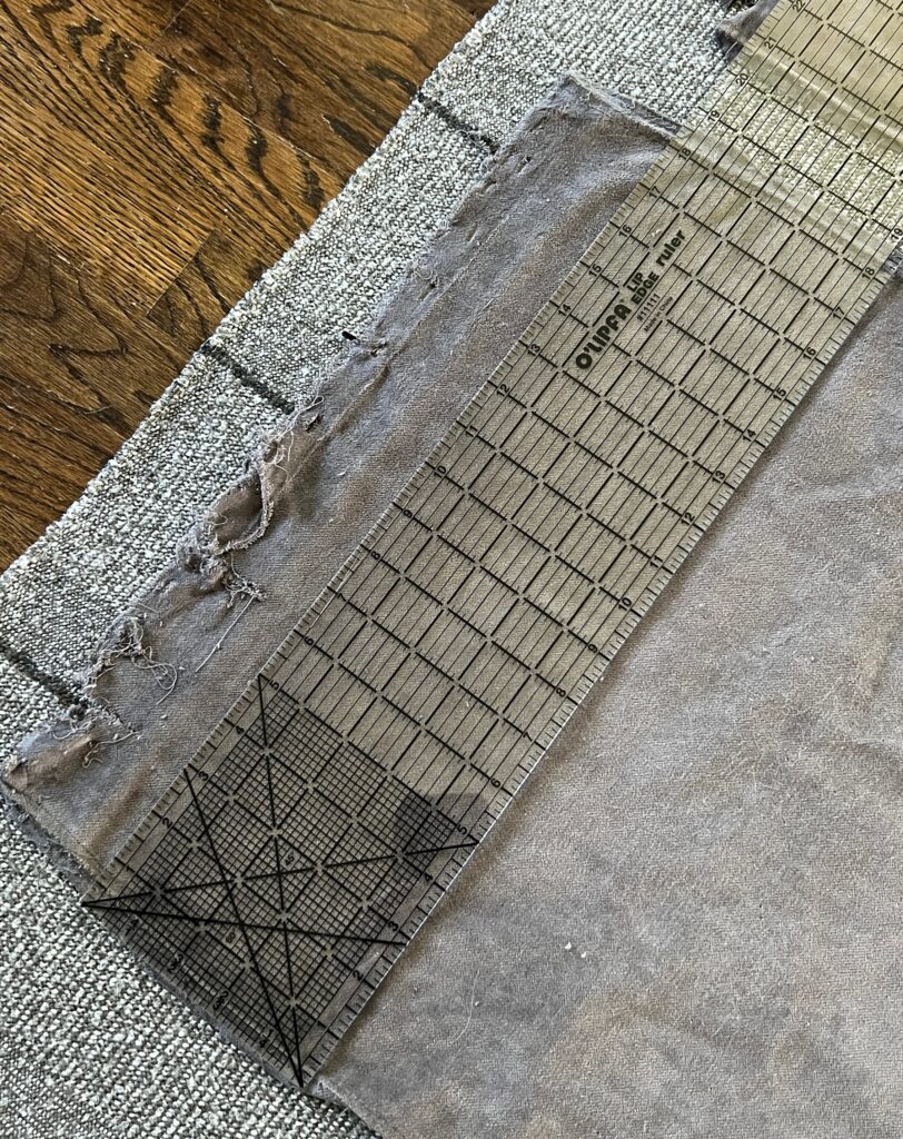 An acrylic ruler measuring the old upholstery
