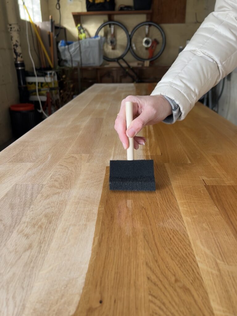 applying pre-stain wood conditioner to butcher block before staining