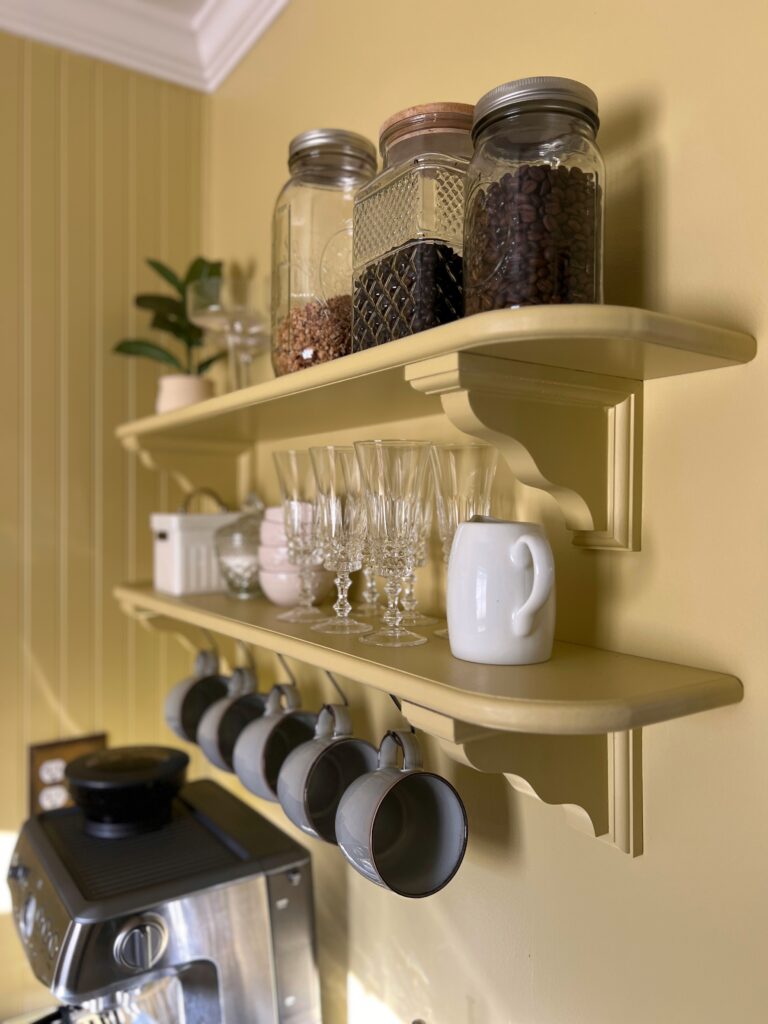 coffee station shelves with mugs hanging