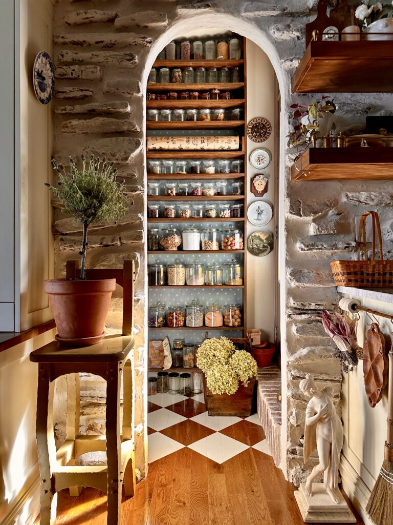 a charming European style walk in pantry