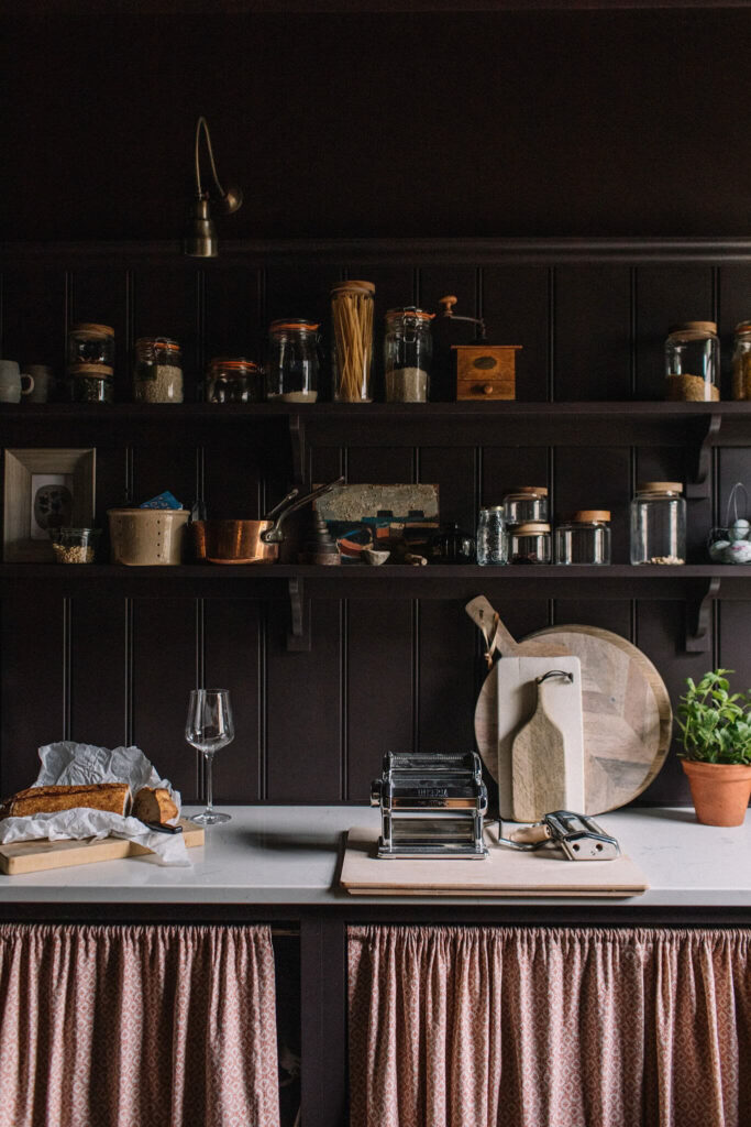 black pantry with white counters