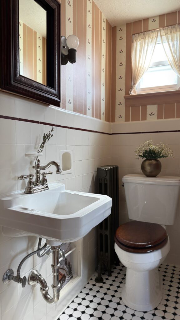 cottage style bathroom with a wood medicine cabinet frame