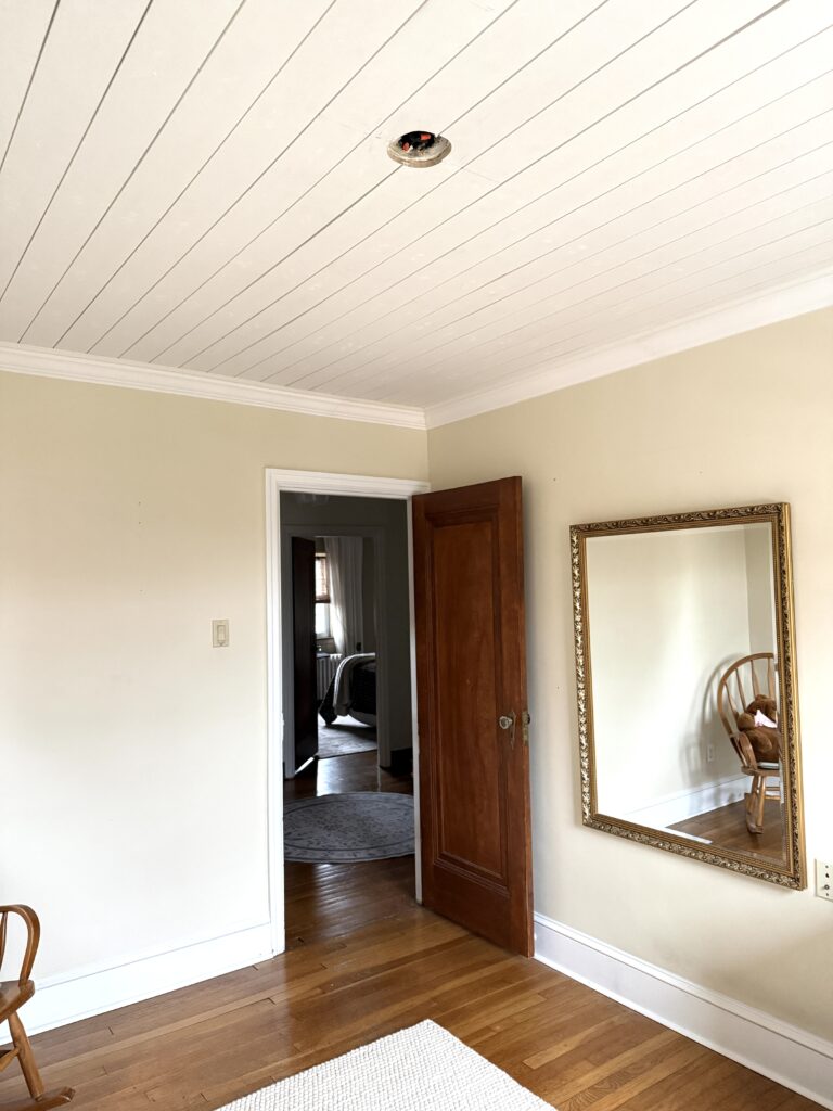 white shiplap ceiling in a nursery