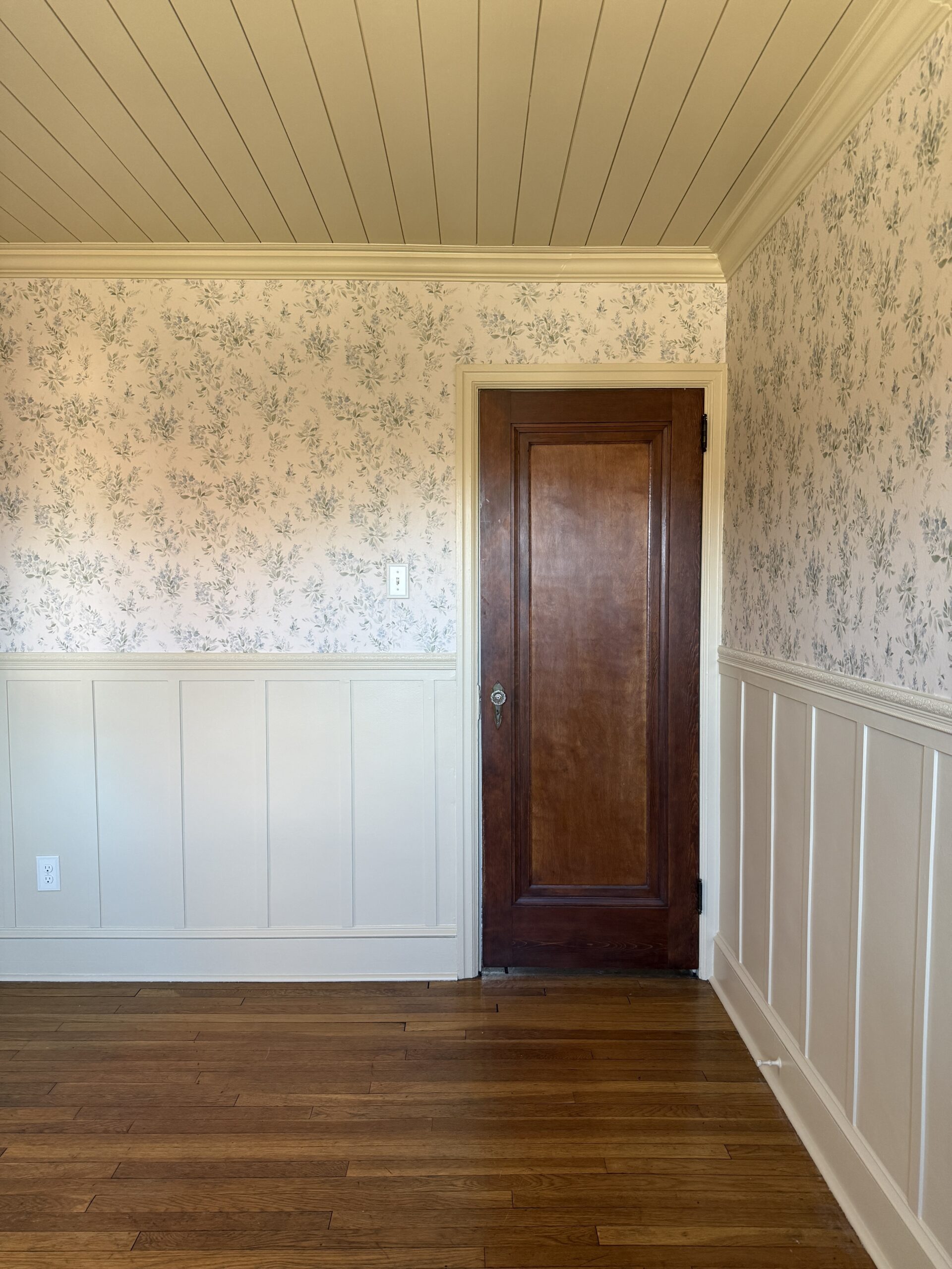 yellow nursery with floral wallpaper