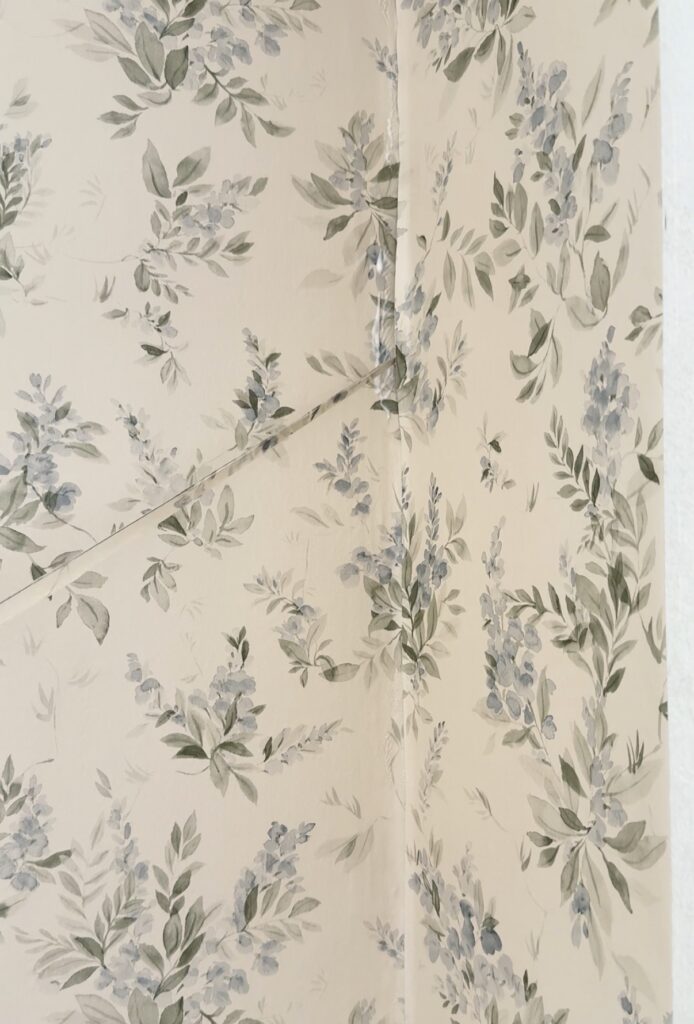 using the double cut method for wallpapering around a corner